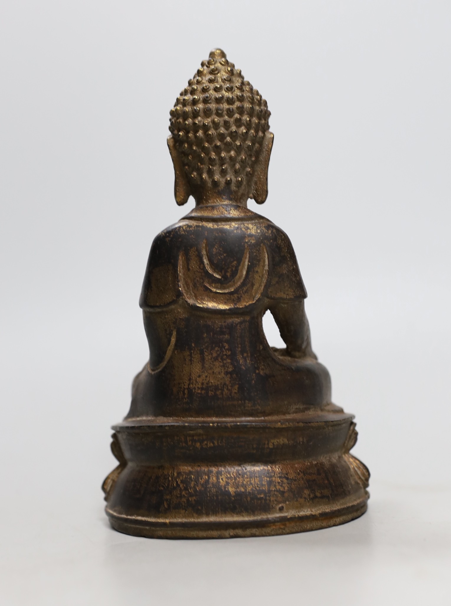 A Chinese gilt iron seated figure of Buddha, 19cm
